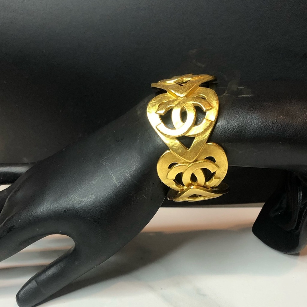 CHANEL Gold Cuff Bracelet with Interlocking CC Open Heart Design